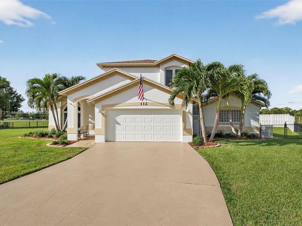 112 Camelot Ct, Royal Palm Beach FL 33411